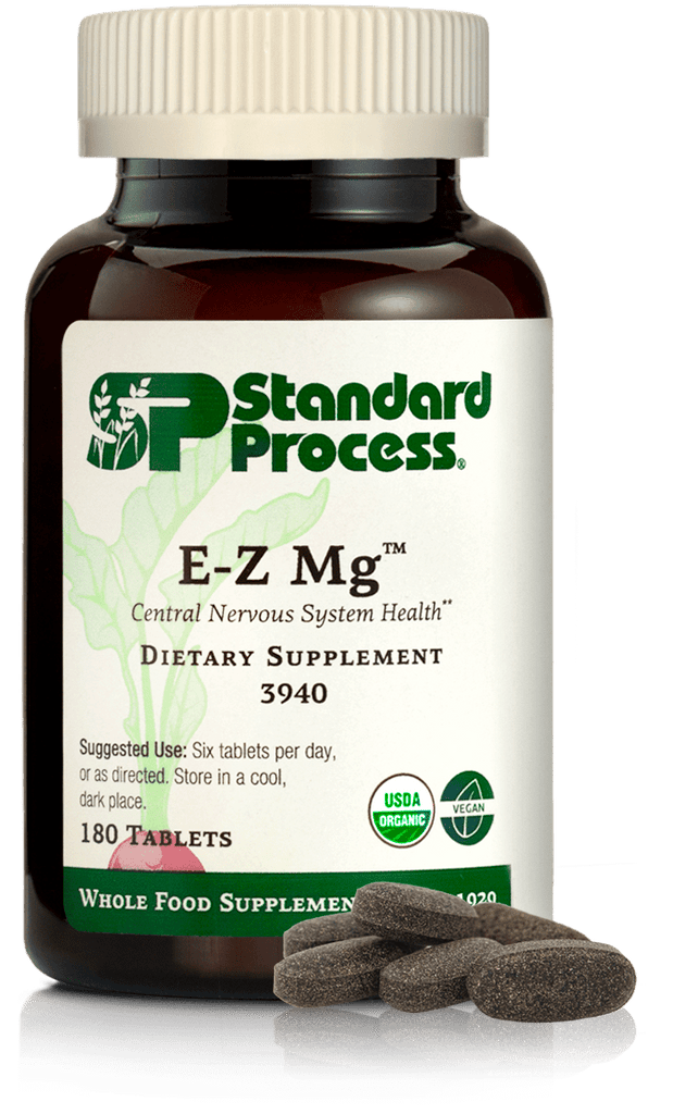 Image of E-Z Mg bottle next to tablets of magnesium supplements.