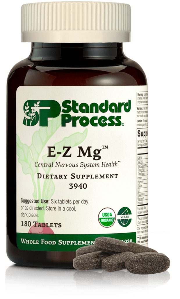 Image of E-Z Mg bottle next to tablets of magnesium supplements.